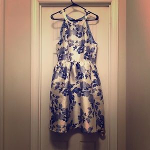 Halter fit & flare dress with blue floral pattern.